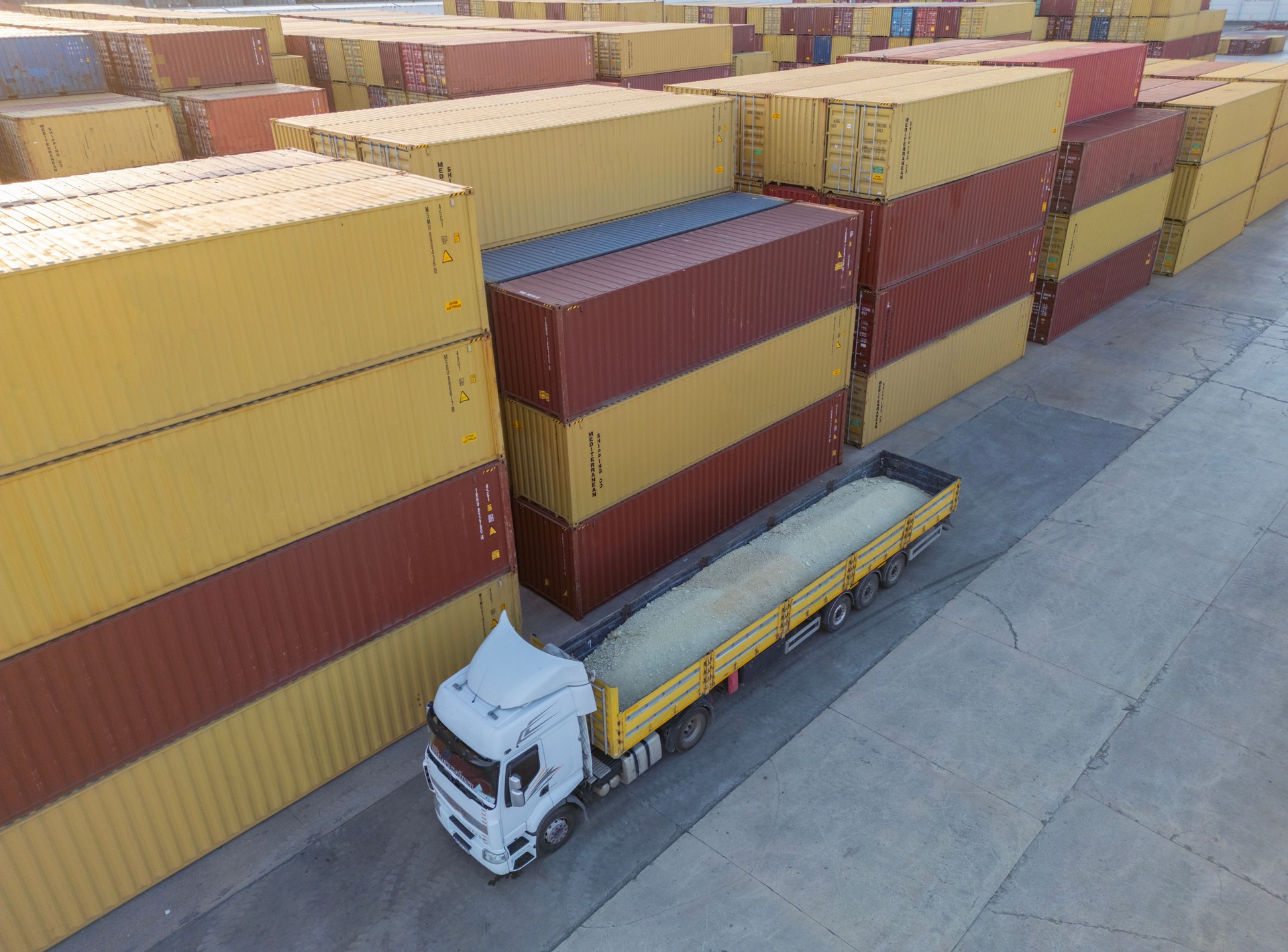 Stacked colorful shipping containers.